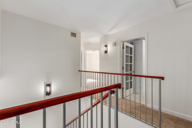 hallway with carpet flooring