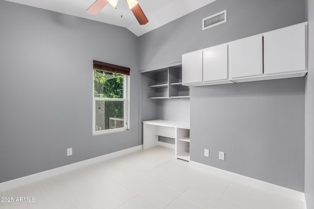 unfurnished bedroom featuring lofted ceiling, a closet, ceiling fan, and light tile patterned flooring