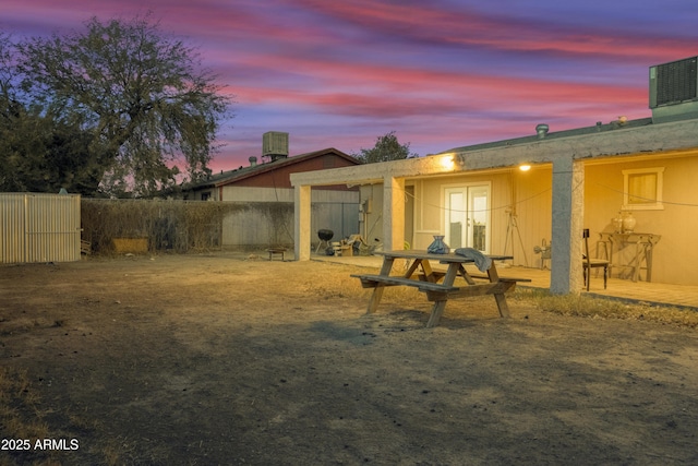 view of back house at dusk