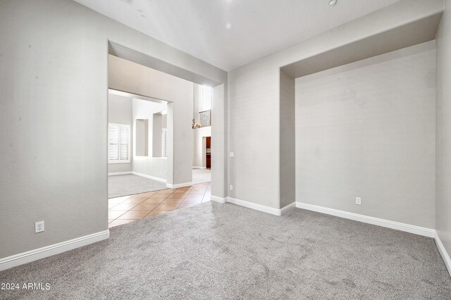 empty room featuring light carpet