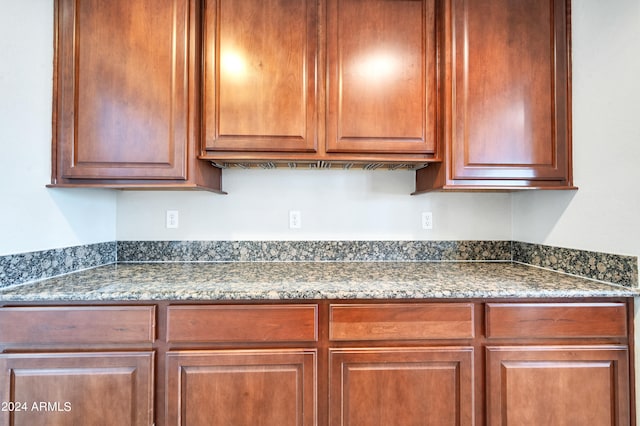 kitchen featuring dark stone counters