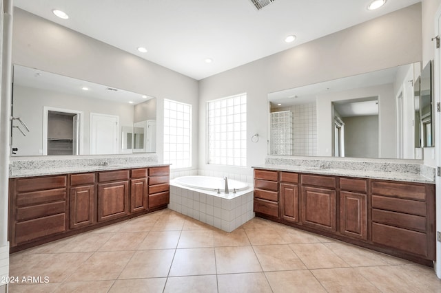 bathroom featuring vanity, tile patterned floors, and shower with separate bathtub