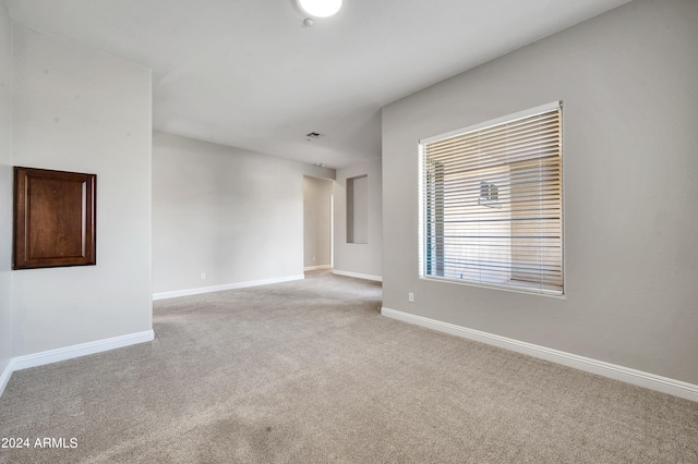 empty room featuring light colored carpet