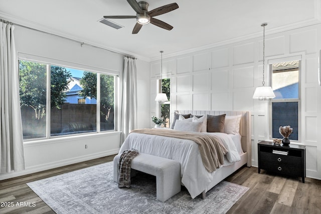 3038 E Longhorn Dr, Gilbert, AZ 85297 - bedroom with a decorative wall, crown molding, wood finished floors, and ceiling fan