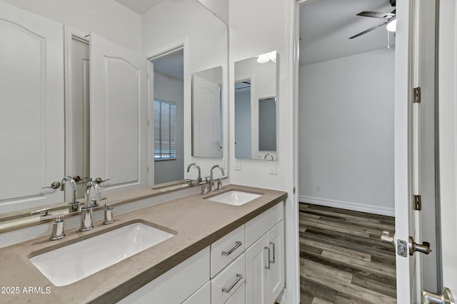 3038 E Longhorn Dr, Gilbert, AZ 85297 - full bath with double vanity, ceiling fan, and wood finished floors
