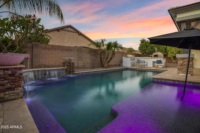 3038 E Longhorn Dr, Gilbert, AZ 85297 - view of pool with an outdoor kitchen, a fenced backyard, and a patio