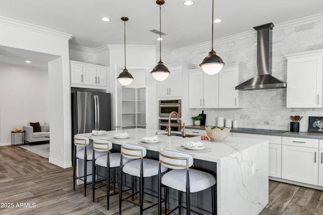 3038 E Longhorn Dr, Gilbert, AZ 85297 - kitchen with wall chimney range hood, a sink, an island with sink, white cabinetry, and recessed lighting