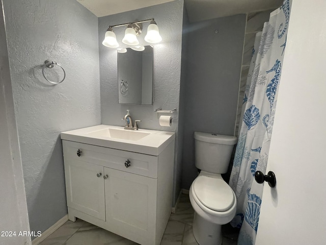 bathroom with vanity, curtained shower, and toilet