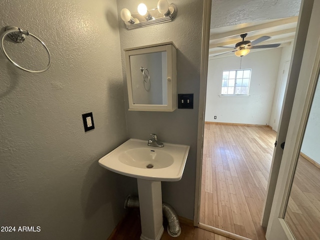 bathroom featuring sink, hardwood / wood-style flooring, and ceiling fan