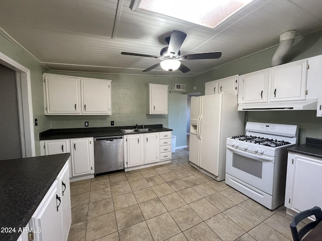 kitchen featuring white cabinetry, sink, and white appliances