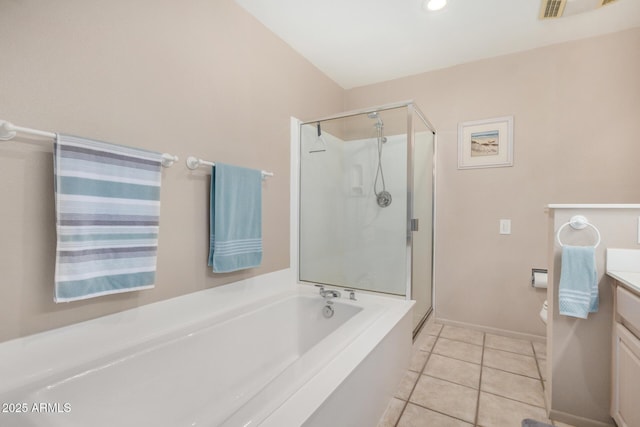 bathroom with vanity, tile patterned flooring, a shower stall, a garden tub, and toilet