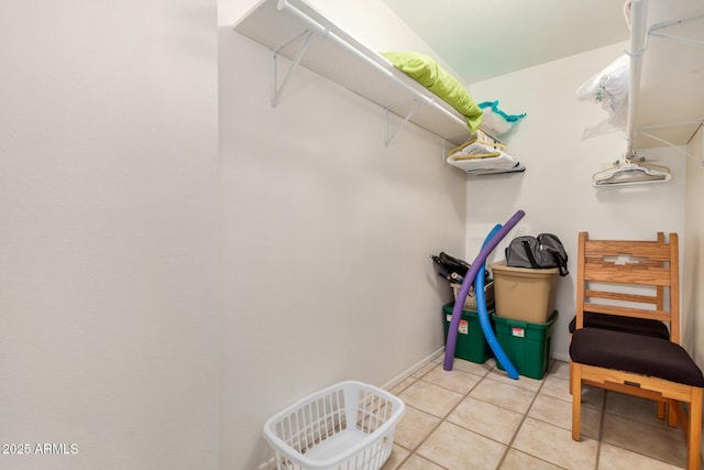 walk in closet featuring light tile patterned flooring