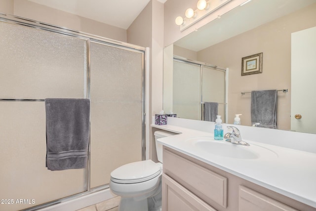 bathroom with vanity, a shower stall, toilet, and tile patterned flooring