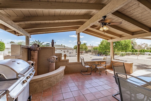 view of patio / terrace with outdoor dining area, a grill, a ceiling fan, and fence