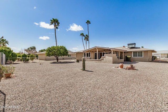 rear view of property with a patio area and a fenced backyard