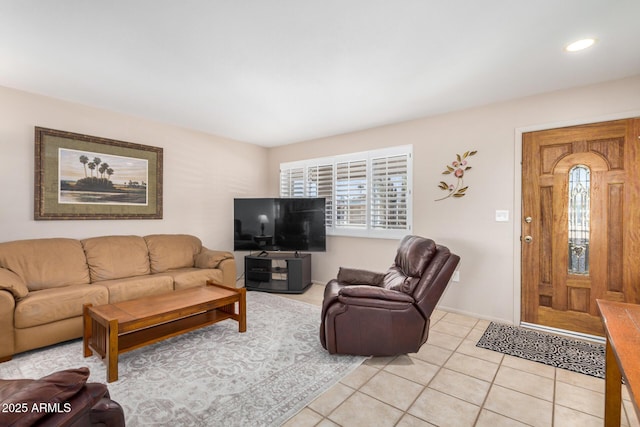 living area featuring light tile patterned floors, recessed lighting, and baseboards