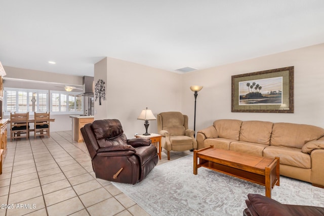 living room with light tile patterned floors and visible vents