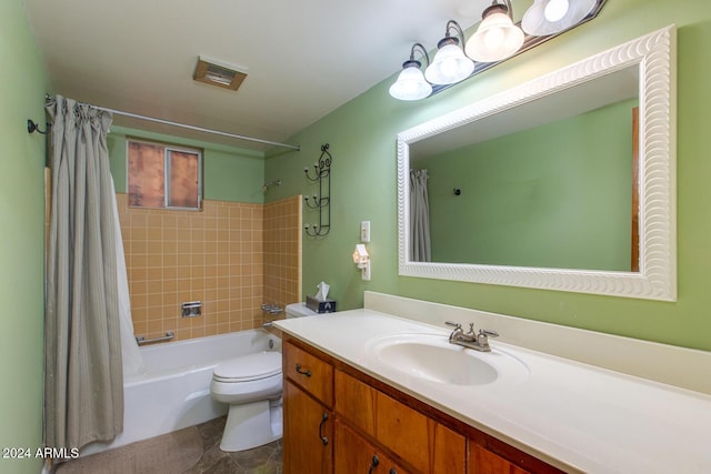 full bathroom featuring tile patterned flooring, vanity, toilet, and shower / bathtub combination with curtain