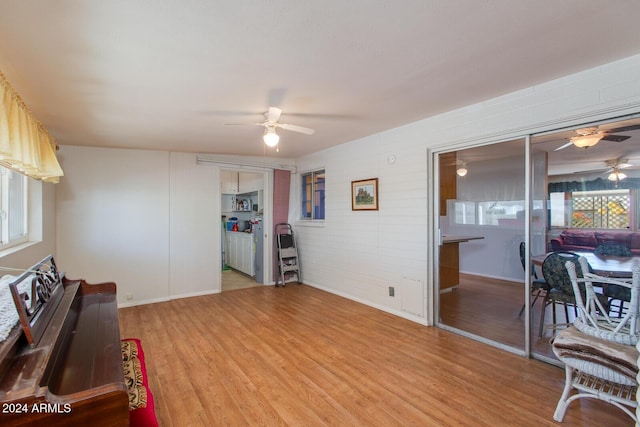 home office featuring hardwood / wood-style floors and ceiling fan