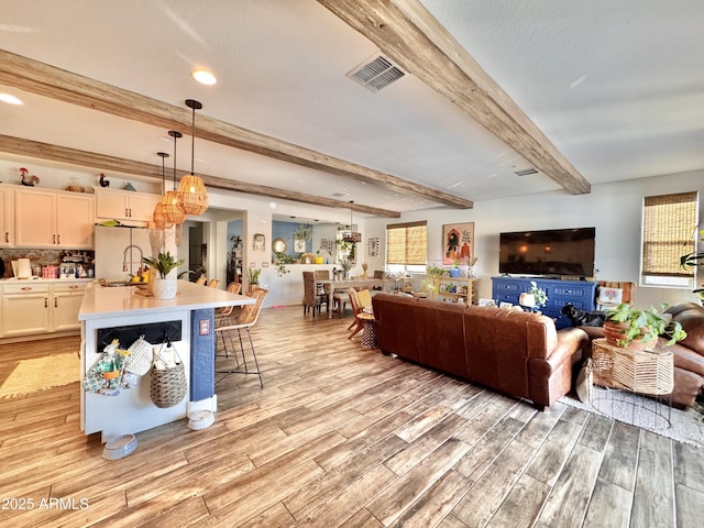 living room with beamed ceiling