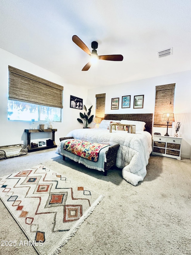 carpeted bedroom with ceiling fan