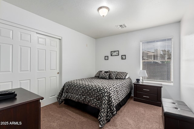 carpeted bedroom featuring a closet