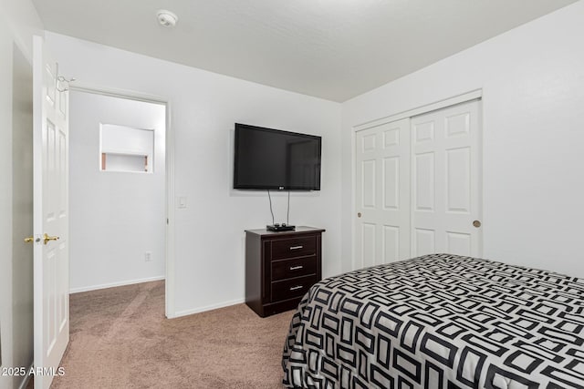 carpeted bedroom with a closet