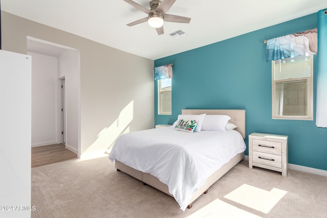 carpeted bedroom with ceiling fan