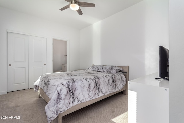 carpeted bedroom with a closet and ceiling fan