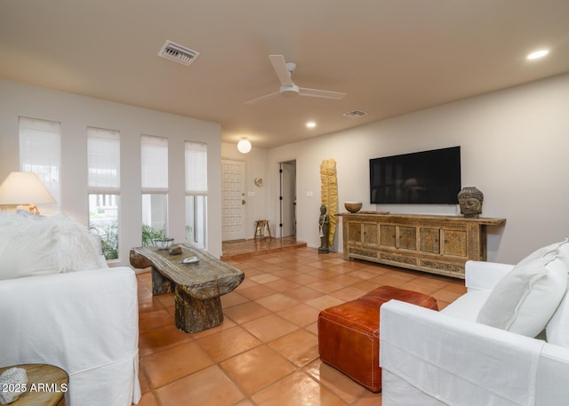 living area featuring ceiling fan, tile patterned flooring, visible vents, and recessed lighting