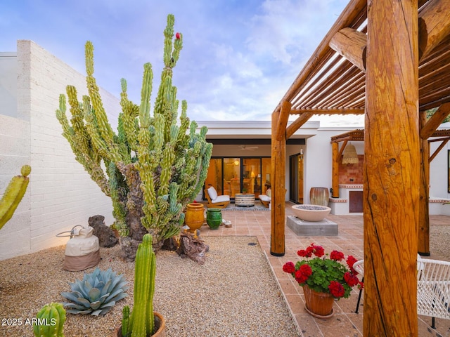 view of patio / terrace featuring an outdoor fire pit