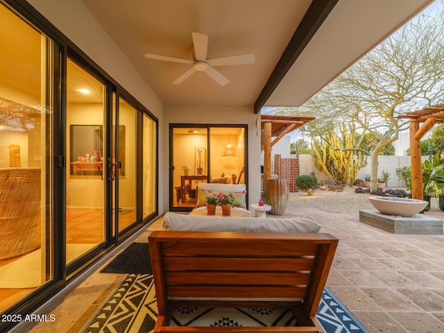 view of patio / terrace with a ceiling fan and fence