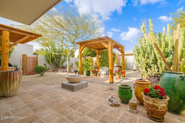 view of patio / terrace with a fenced backyard and a pergola