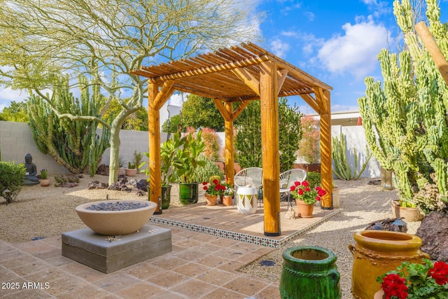 view of patio / terrace with a fenced backyard and a pergola