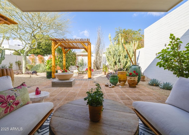 view of patio / terrace with a fenced backyard, a pergola, and outdoor dining space