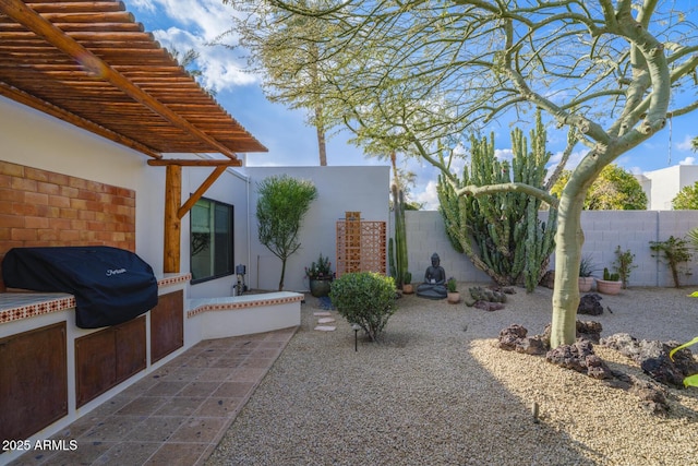 view of yard featuring a patio area and fence