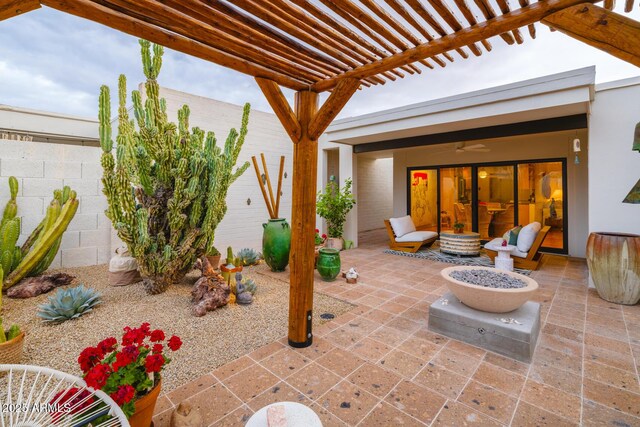 view of patio / terrace featuring fence