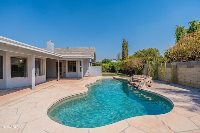 view of pool featuring a patio