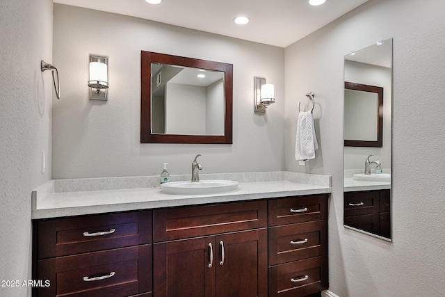 bathroom with vanity and recessed lighting