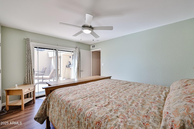 bedroom with a ceiling fan, access to outside, visible vents, and dark wood finished floors