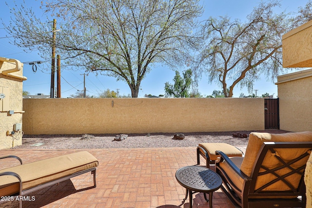 view of patio / terrace featuring fence