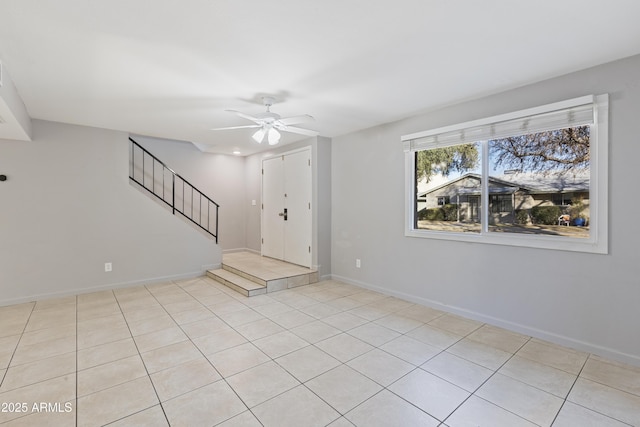 interior space featuring ceiling fan