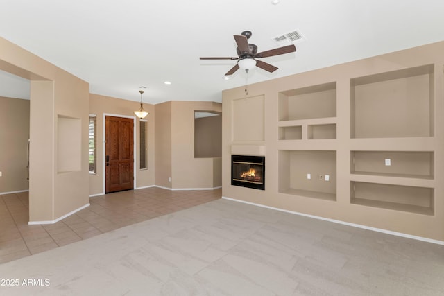 42122 N Anthem Springs Rd, Anthem, AZ 85086 - unfurnished living room featuring tile patterned flooring, built in features, carpet, ceiling fan, and recessed lighting