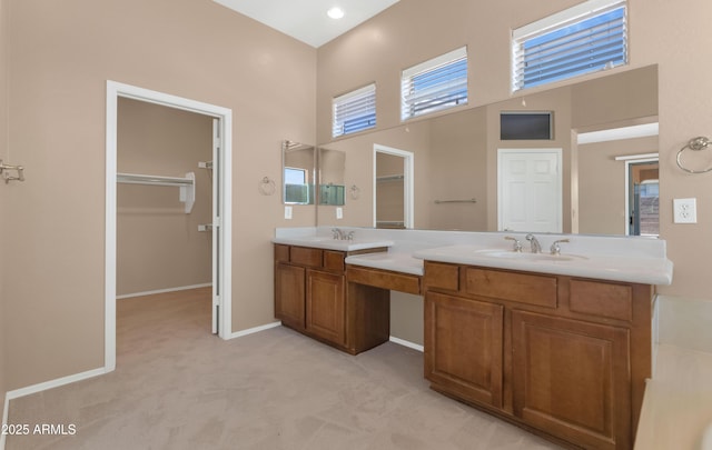 42122 N Anthem Springs Rd, Anthem, AZ 85086 - bathroom with a high ceiling, double vanity, and a spacious closet