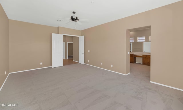 42122 N Anthem Springs Rd, Anthem, AZ 85086 - unfurnished bedroom featuring light carpet and ceiling fan
