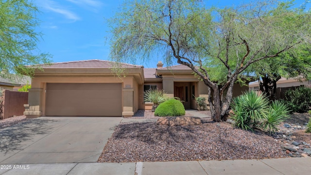 42122 N Anthem Springs Rd, Anthem, AZ 85086 - view of front of property featuring a garage, stucco siding, concrete driveway, and a tiled roof