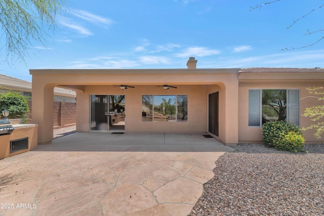 42122 N Anthem Springs Rd, Anthem, AZ 85086 - rear view of house with a ceiling fan, stucco siding, and a patio area