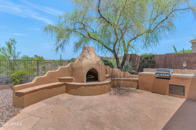 42122 N Anthem Springs Rd, Anthem, AZ 85086 - view of patio with an outdoor fireplace and exterior kitchen