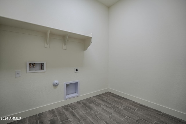 laundry area with hookup for a gas dryer, hookup for an electric dryer, laundry area, washer hookup, and wood tiled floor