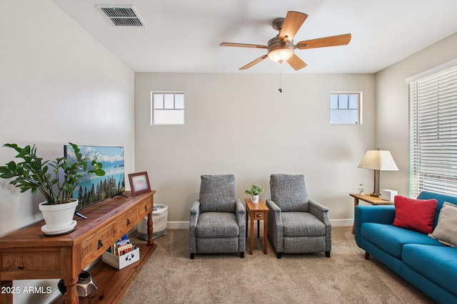 5724 N 108th Ave, Phoenix, AZ 85037 - carpeted living area featuring healthy amount of natural light and ceiling fan